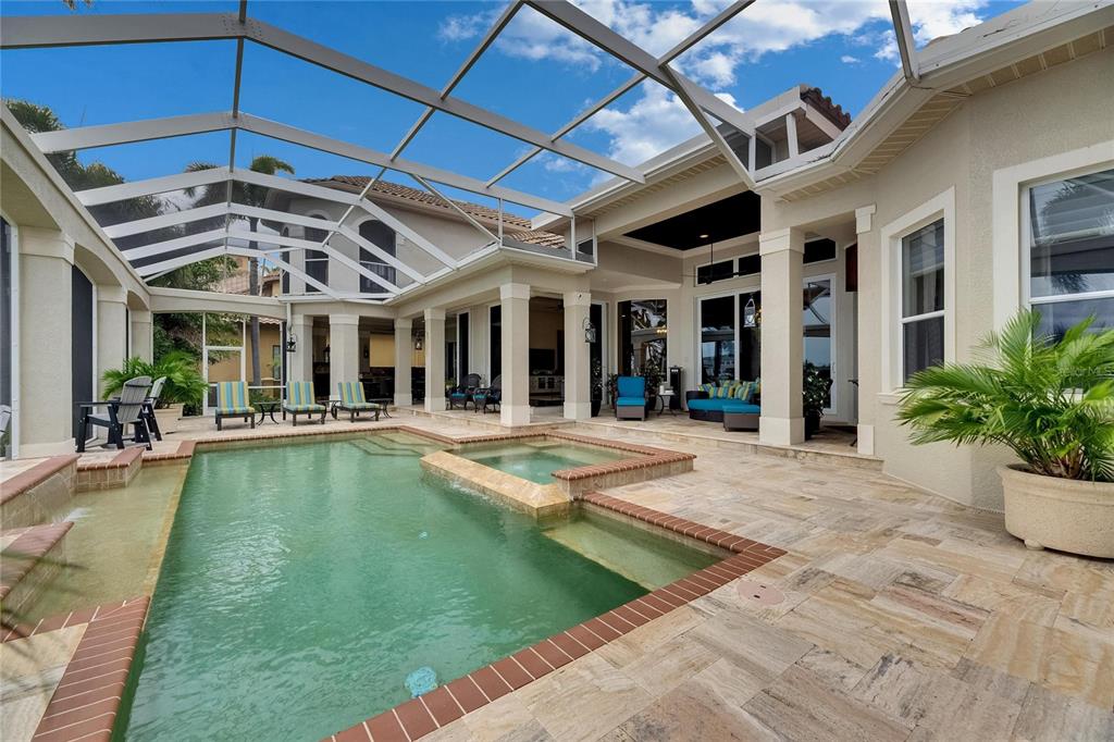 624 Balibay Road Apollo Beach, FL 33572 - Photo 13 of 99 a view of a patio with swimming pool table and chairs