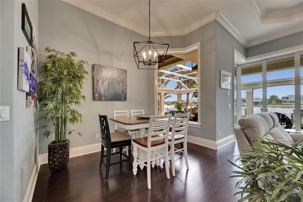 624 Balibay Road Apollo Beach, FL 33572 - Photo 31 of 99 a view of a dining room with furniture window and wooden floor
