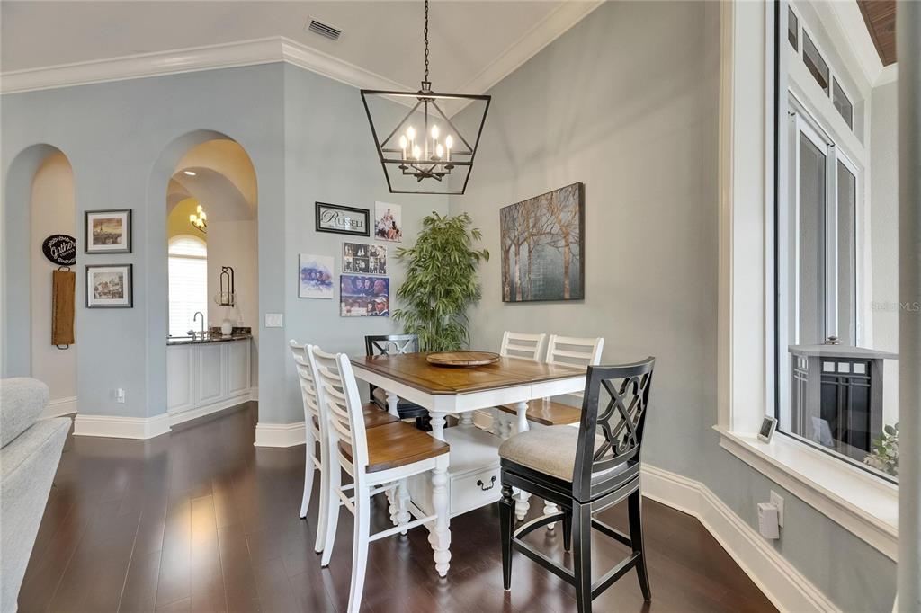624 Balibay Road Apollo Beach, FL 33572 - Photo 32 of 99 a view of a dining room with furniture window and wooden floor