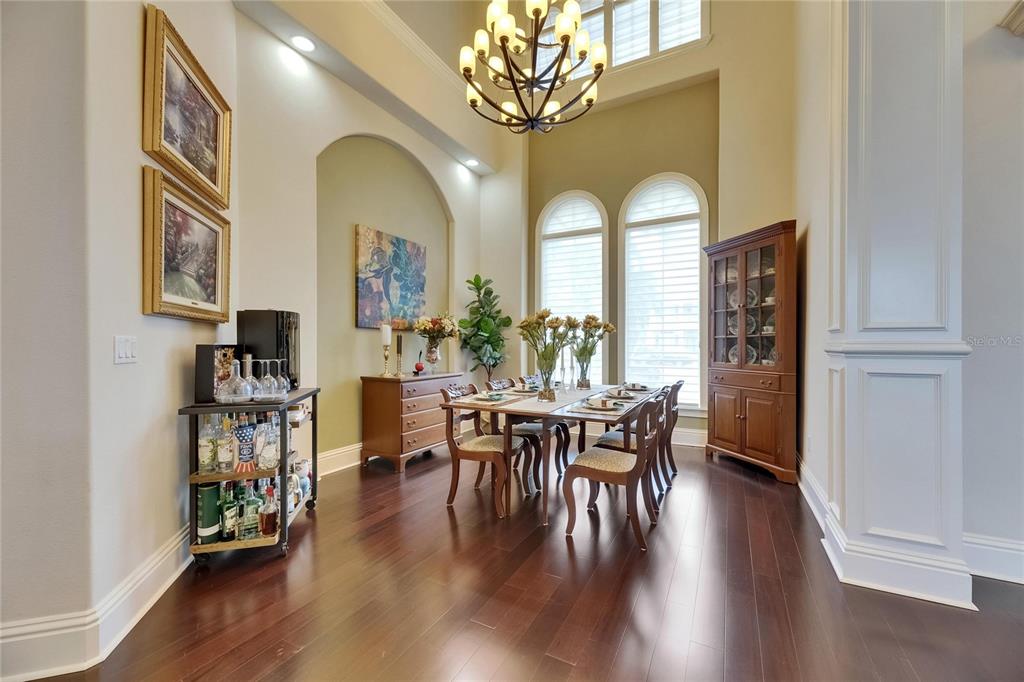 624 Balibay Road Apollo Beach, FL 33572 - Photo 40 of 99 a view of a dining room with furniture window and wooden floor