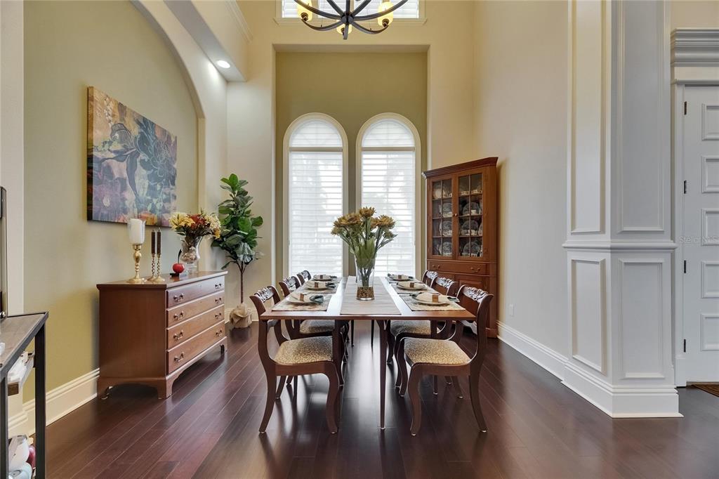 624 Balibay Road Apollo Beach, FL 33572 - Photo 41 of 99 a view of a dining room with furniture and wooden floor