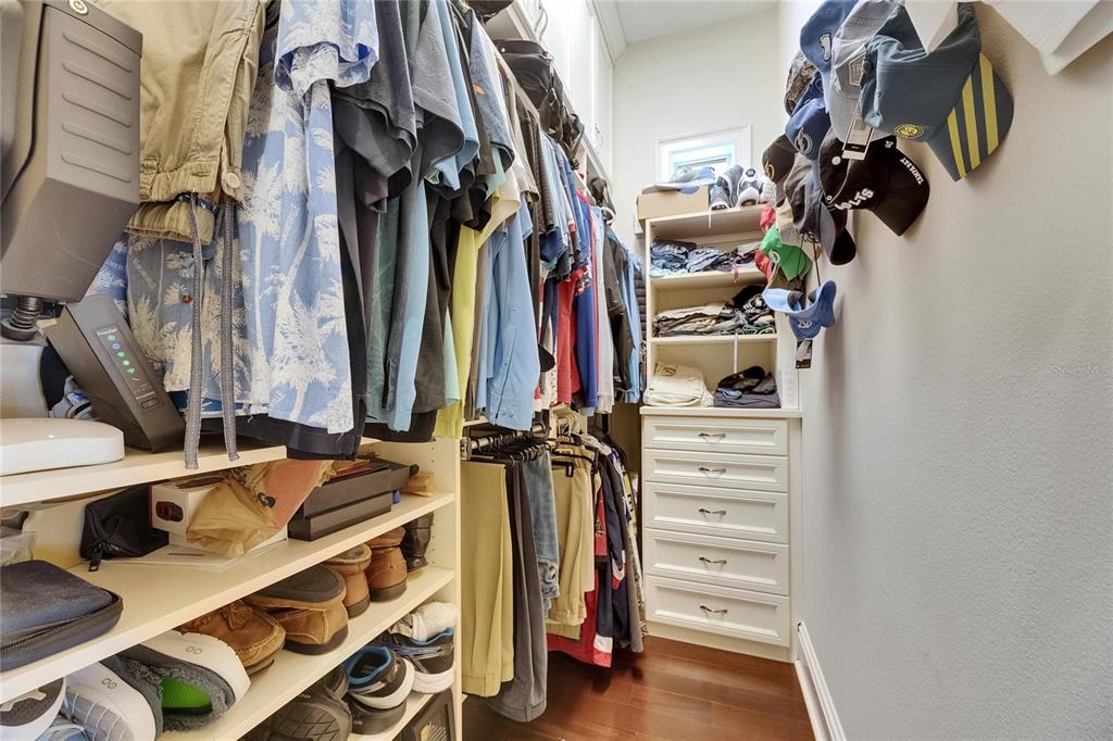 624 Balibay Road Apollo Beach, FL 33572 - Photo 52 of 99 a view of walk in closet with clothes and shoes