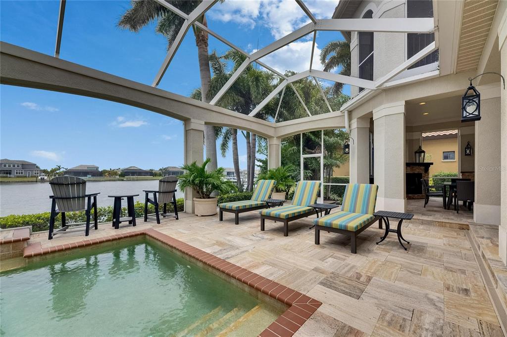 624 Balibay Road Apollo Beach, FL 33572 - Photo 86 of 99 a view of a patio with couches table and chairs with potted plants