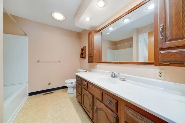 a view of a room with wooden walls