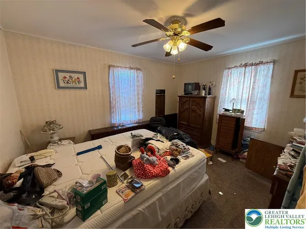 a bedroom with a bed and furniture