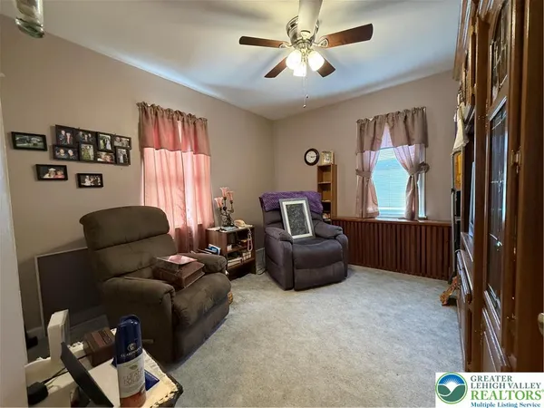 a living room with furniture and a window