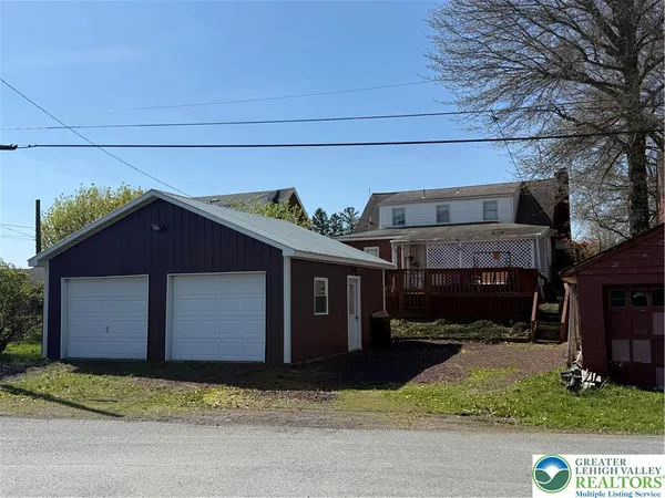 a house with trees in front of it