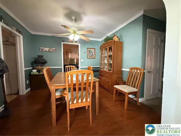 a dining room with furniture and window
