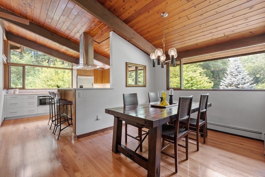 237 Stoney Gate Carlisle, MA 01741 - Photo 15 of 35 a view of a dining room with furniture window and wooden floor