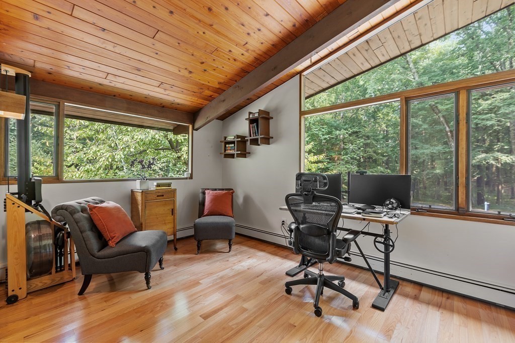 237 Stoney Gate Carlisle, MA 01741 - Photo 17 of 35 a work room with wooden floor and furniture