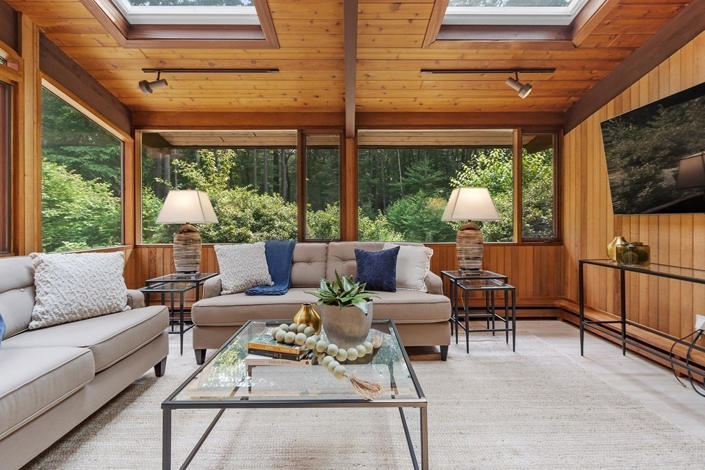 237 Stoney Gate Carlisle, MA 01741 - Photo 27 of 35 a outdoor space with patio the couches and a dining table with the garden view