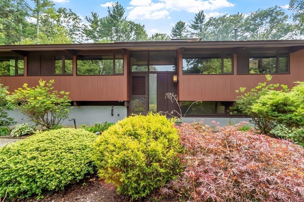 237 Stoney Gate Carlisle, MA 01741 - Photo 3 of 35 front view of a house with a big yard