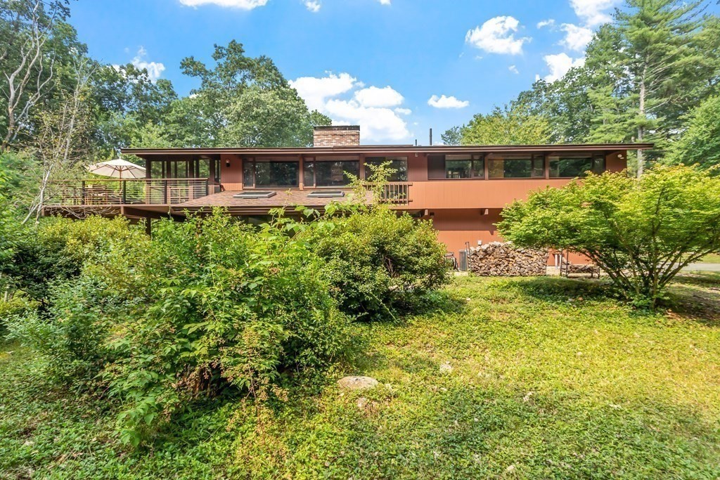 237 Stoney Gate Carlisle, MA 01741 - Photo 31 of 35 a view of a house with a yard and sitting area