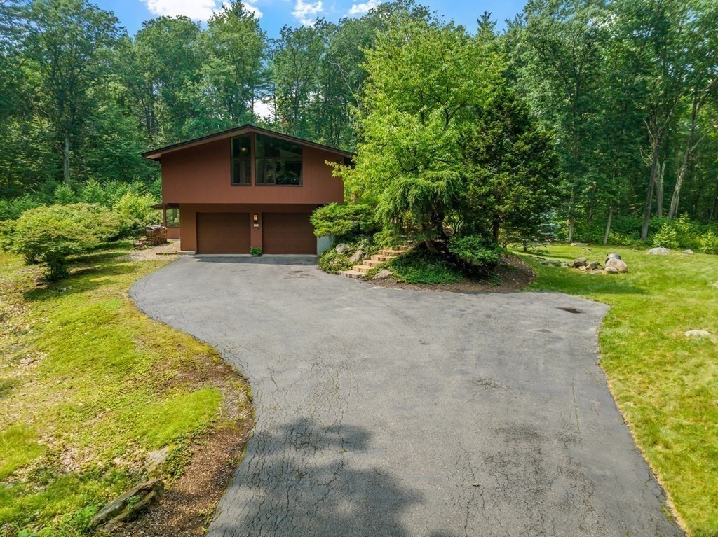 237 Stoney Gate Carlisle, MA 01741 - Photo 32 of 35 a view of a house with a yard