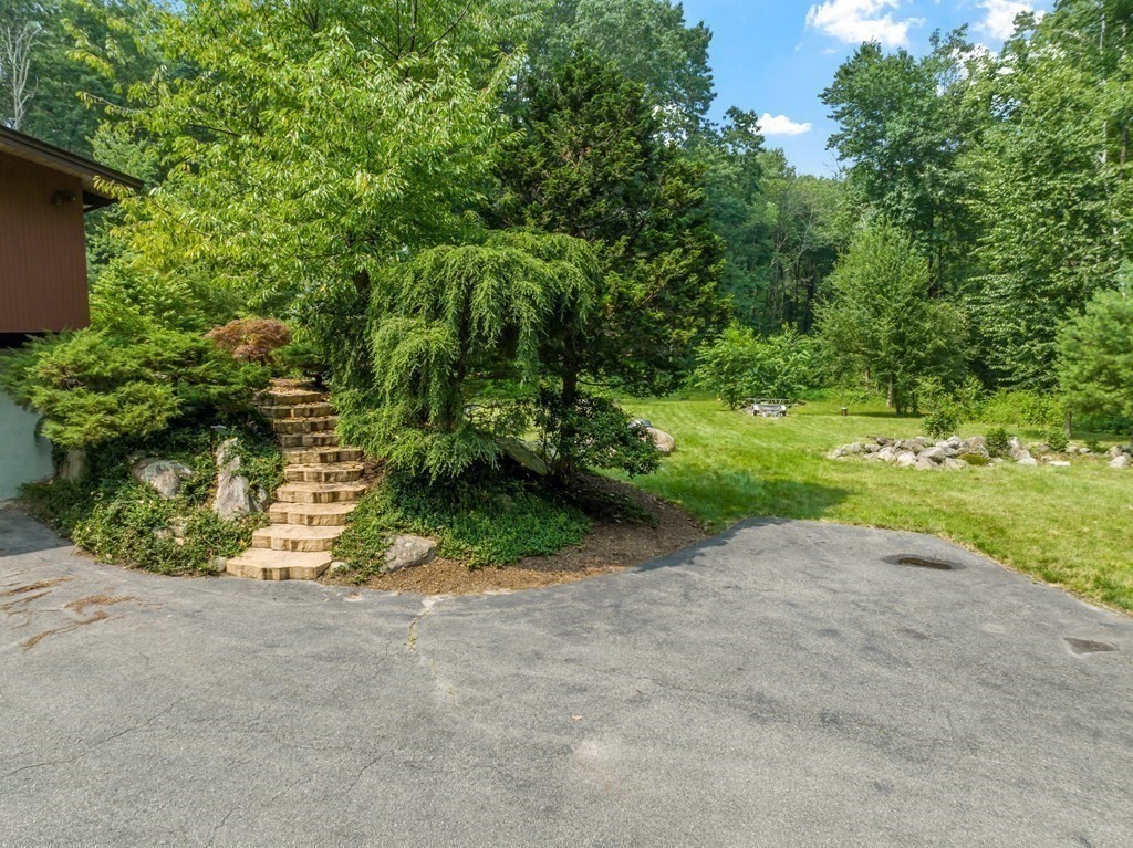 237 Stoney Gate Carlisle, MA 01741 - Photo 33 of 35 a view of a road with a yard
