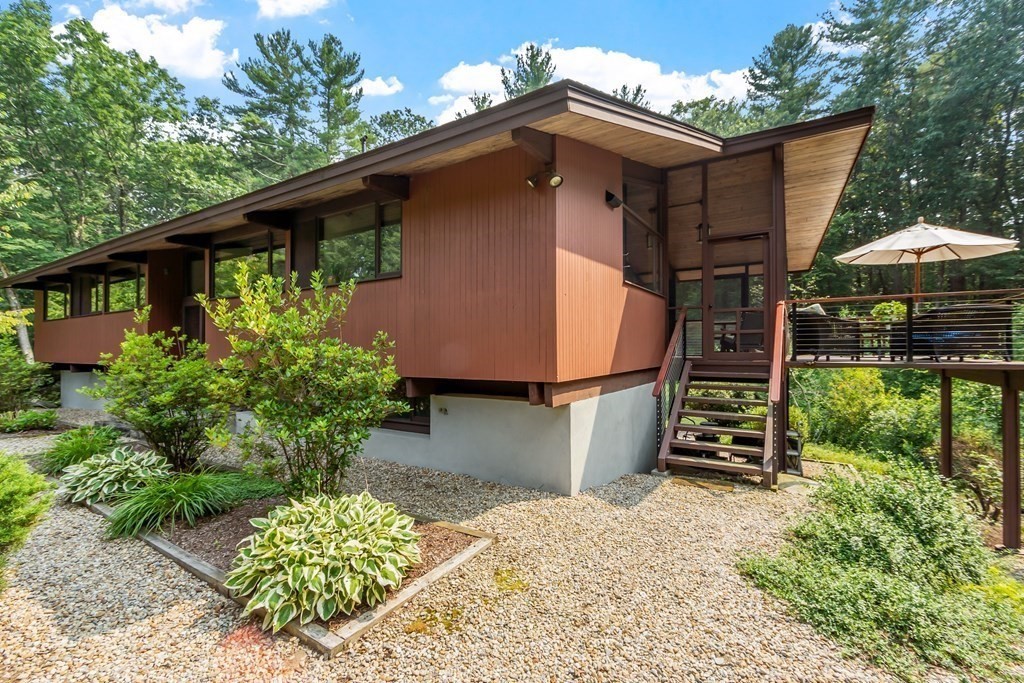 237 Stoney Gate Carlisle, MA 01741 - Photo 4 of 35 a view of a back yard of the house
