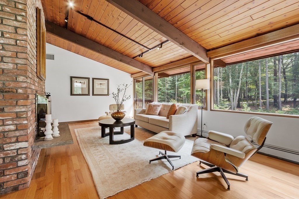 237 Stoney Gate Carlisle, MA 01741 - Photo 6 of 35 a living room with furniture and a large window