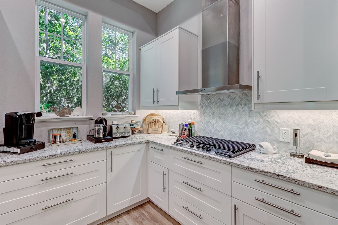 2629 Racheal Avenue Fernandina Beach, FL 32034 - Photo 11 of 53 a kitchen with granite countertop white cabinets and white appliances