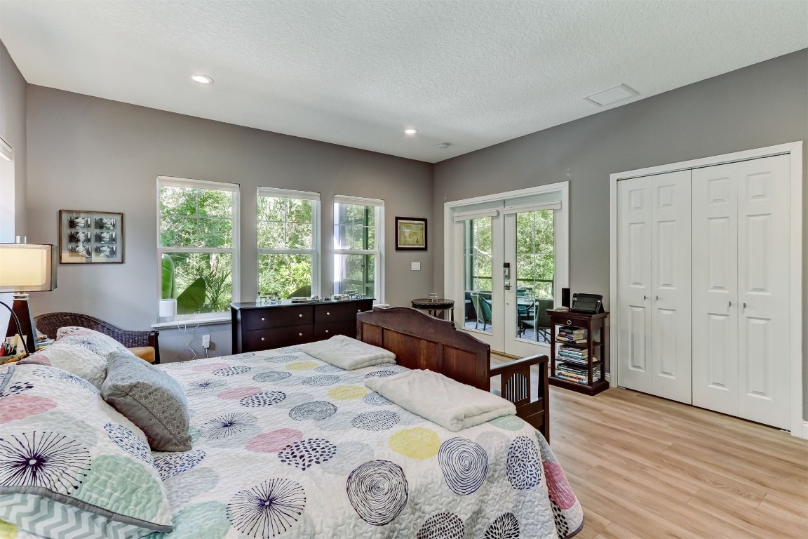 2629 Racheal Avenue Fernandina Beach, FL 32034 - Photo 16 of 53 a bedroom with a bed and wooden floor