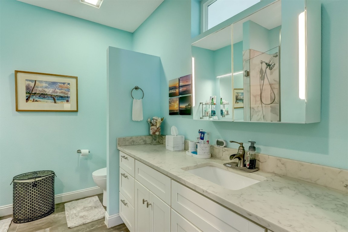 2629 Racheal Avenue Fernandina Beach, FL 32034 - Photo 17 of 53 a bathroom with a toilet a sink and mirror