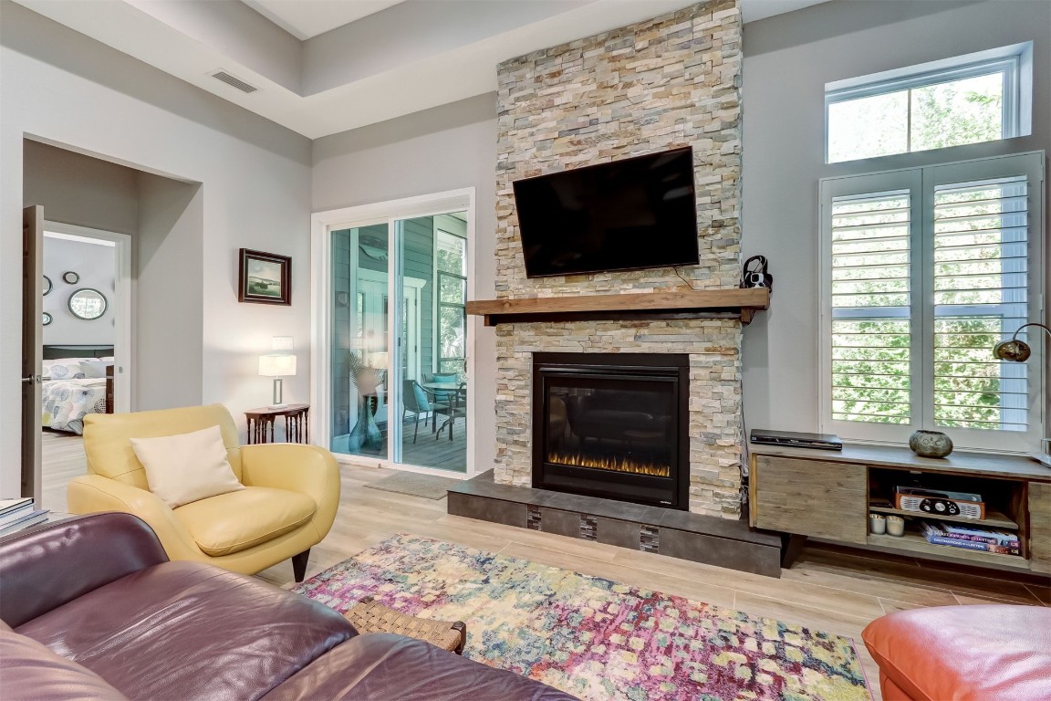 2629 Racheal Avenue Fernandina Beach, FL 32034 - Photo 42 of 53 a living room with furniture a flat screen tv and a fireplace
