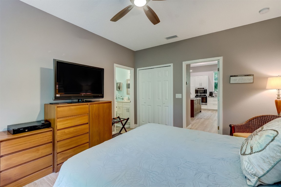 2629 Racheal Avenue Fernandina Beach, FL 32034 - Photo 46 of 53 a bedroom with a bed and a flat tv screen on dresser