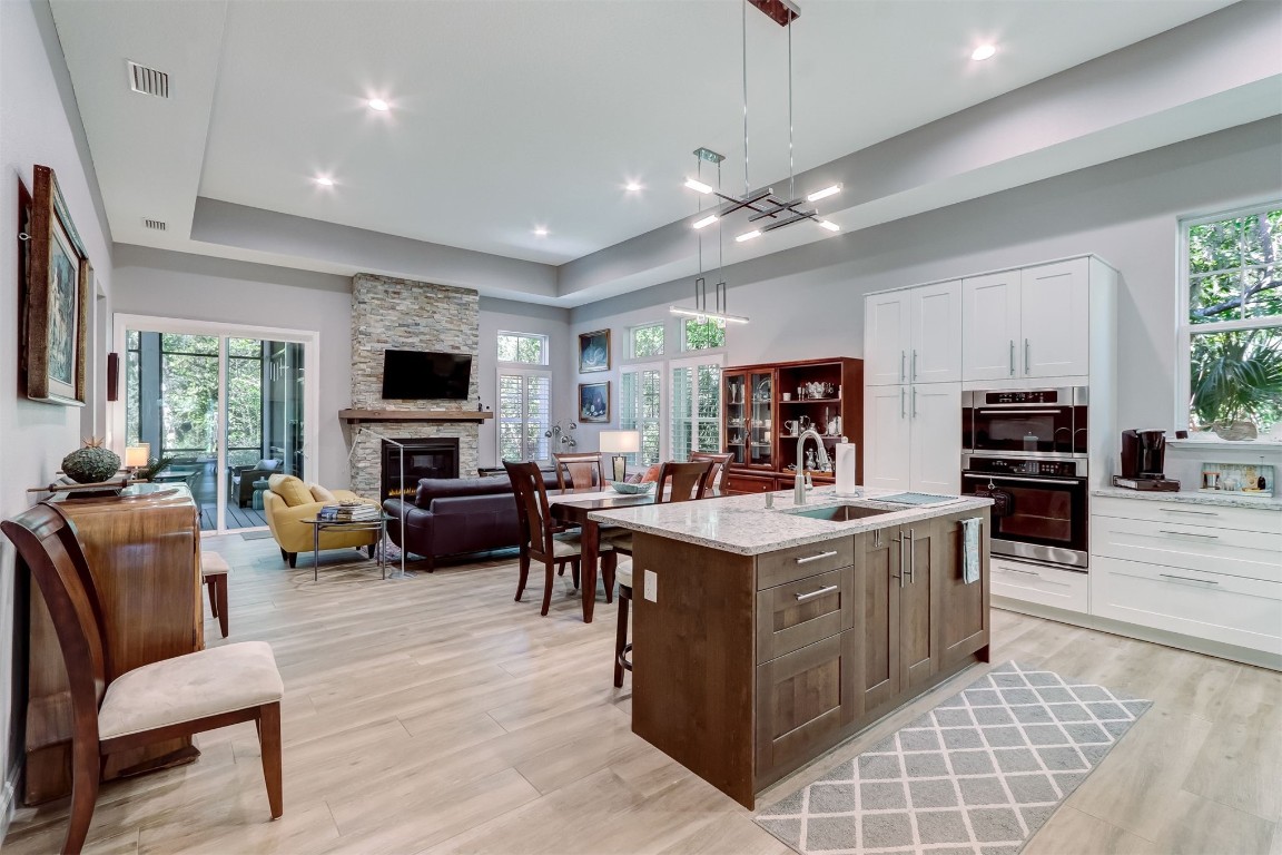 2629 Racheal Avenue Fernandina Beach, FL 32034 - Photo 6 of 53 a view of living room kitchen with stainless steel appliances granite countertop couches a flat screen tv