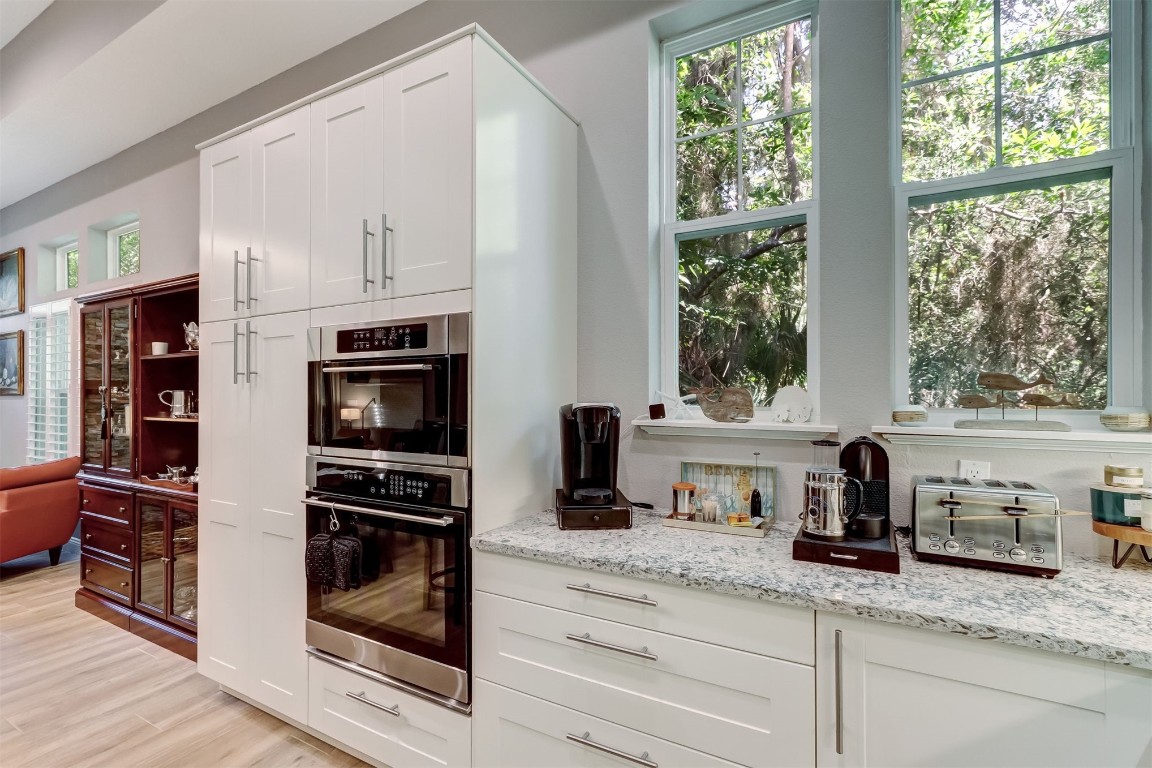 2629 Racheal Avenue Fernandina Beach, FL 32034 - Photo 10 of 53 a kitchen with granite countertop a refrigerator and a sink