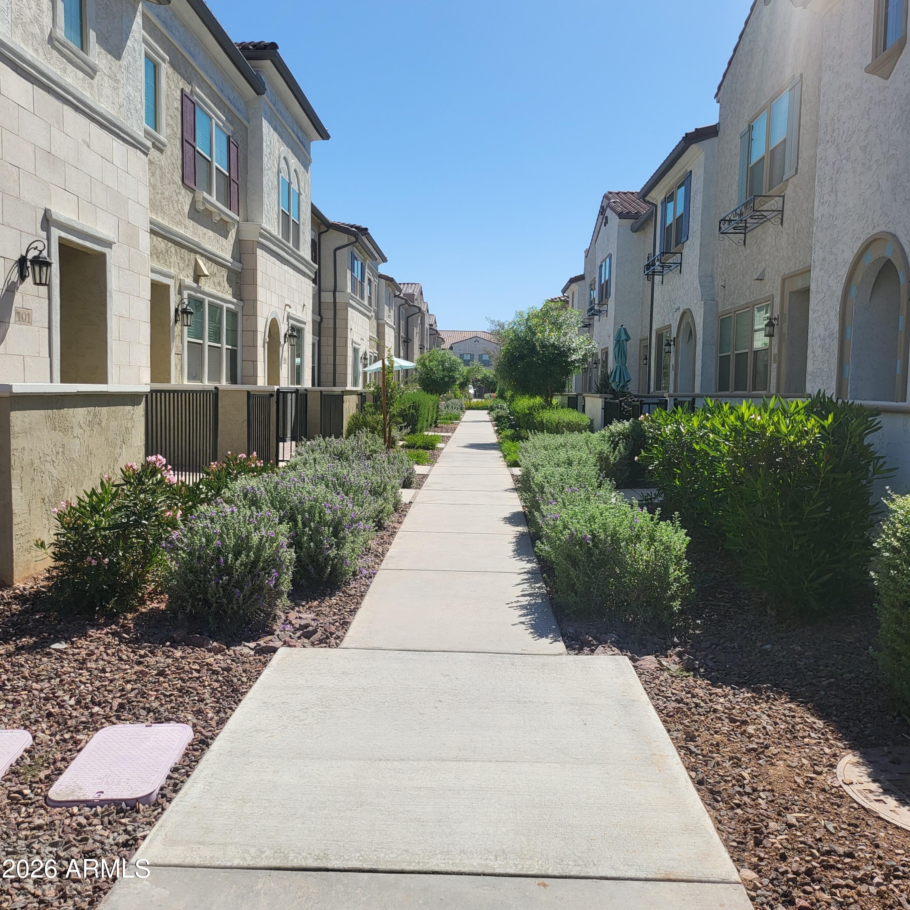 1821 East Bernie Lane, Unit 103 Gilbert, AZ 85295 - Photo 2 of 57 Annecy sidewalk entrance to townhome