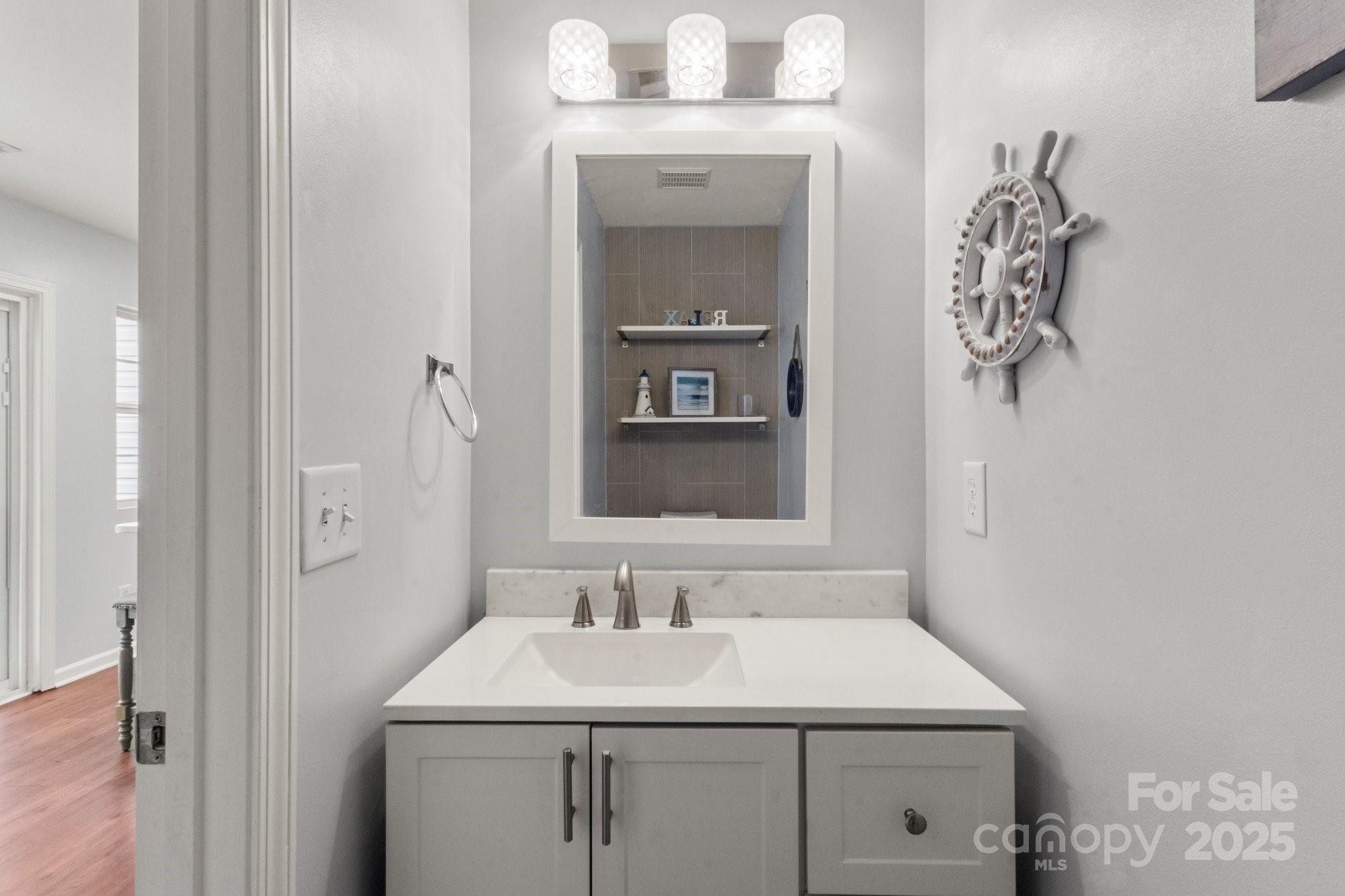 11023 Kinston Ridge Place Charlotte, NC 28273 - Photo 11 of 25 a bathroom with a sink and a mirror