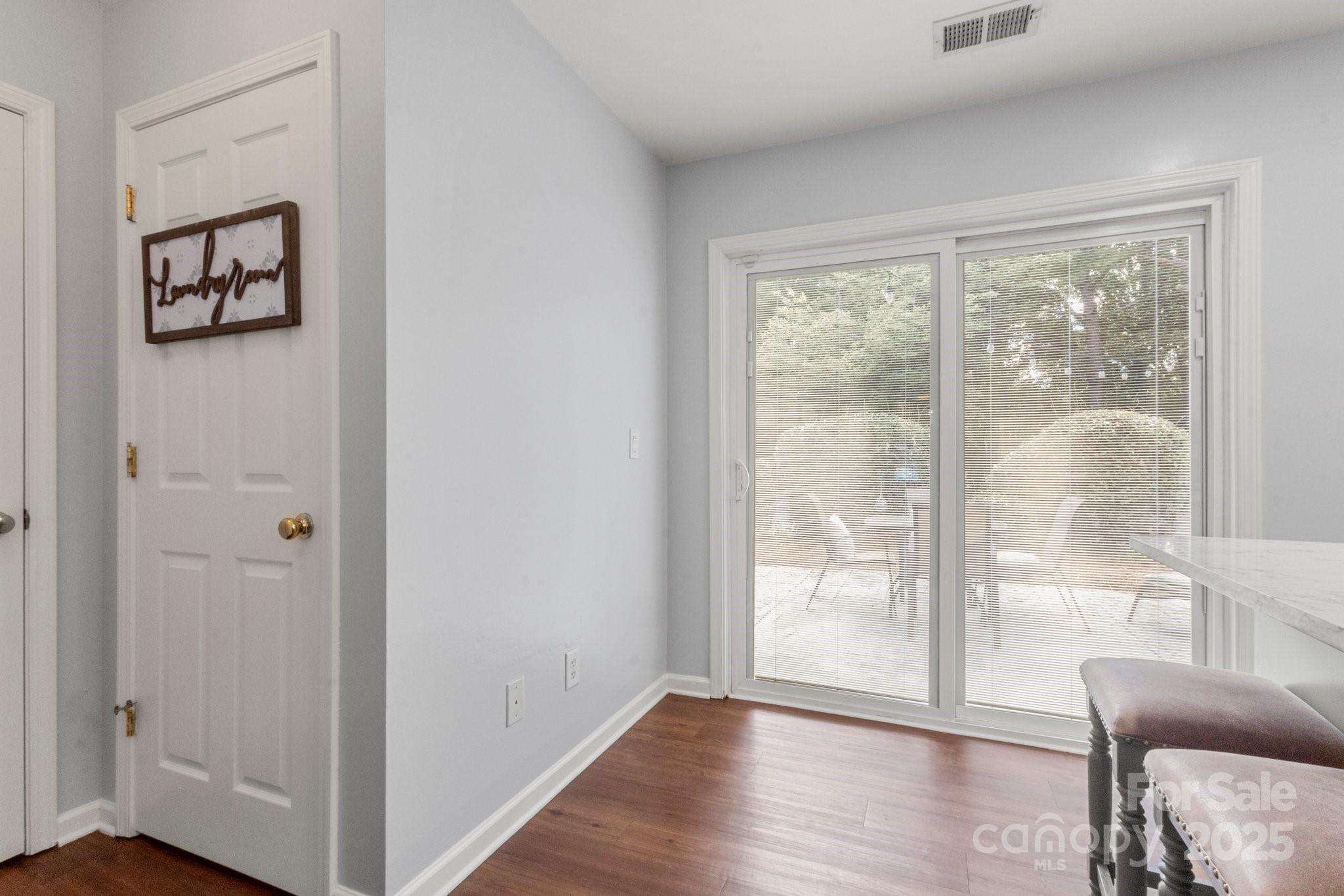 11023 Kinston Ridge Place Charlotte, NC 28273 - Photo 12 of 25 a view of a livingroom with wooden floor and white walls