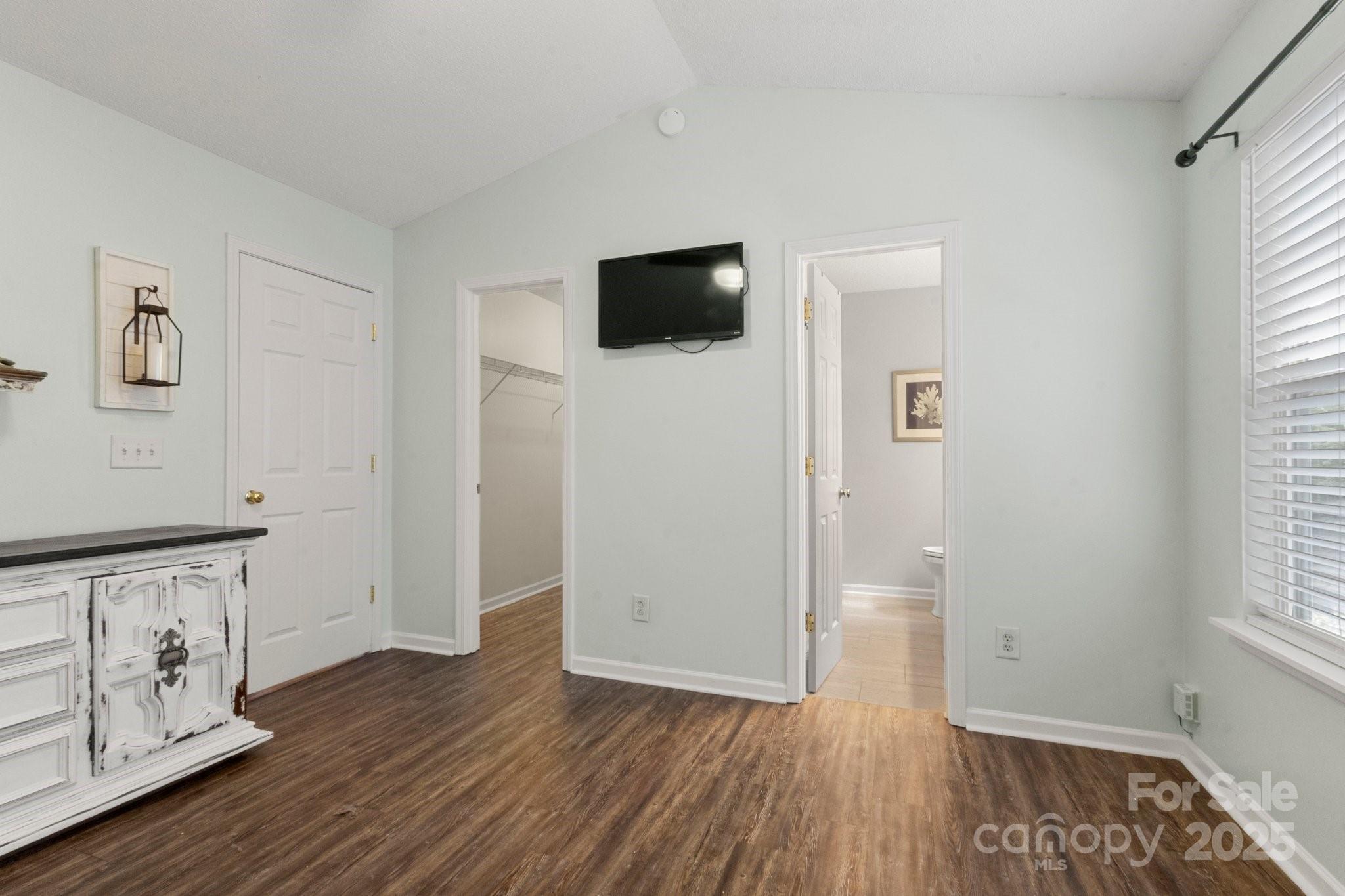 11023 Kinston Ridge Place Charlotte, NC 28273 - Photo 17 of 25 a view of an empty room with window and wooden floor