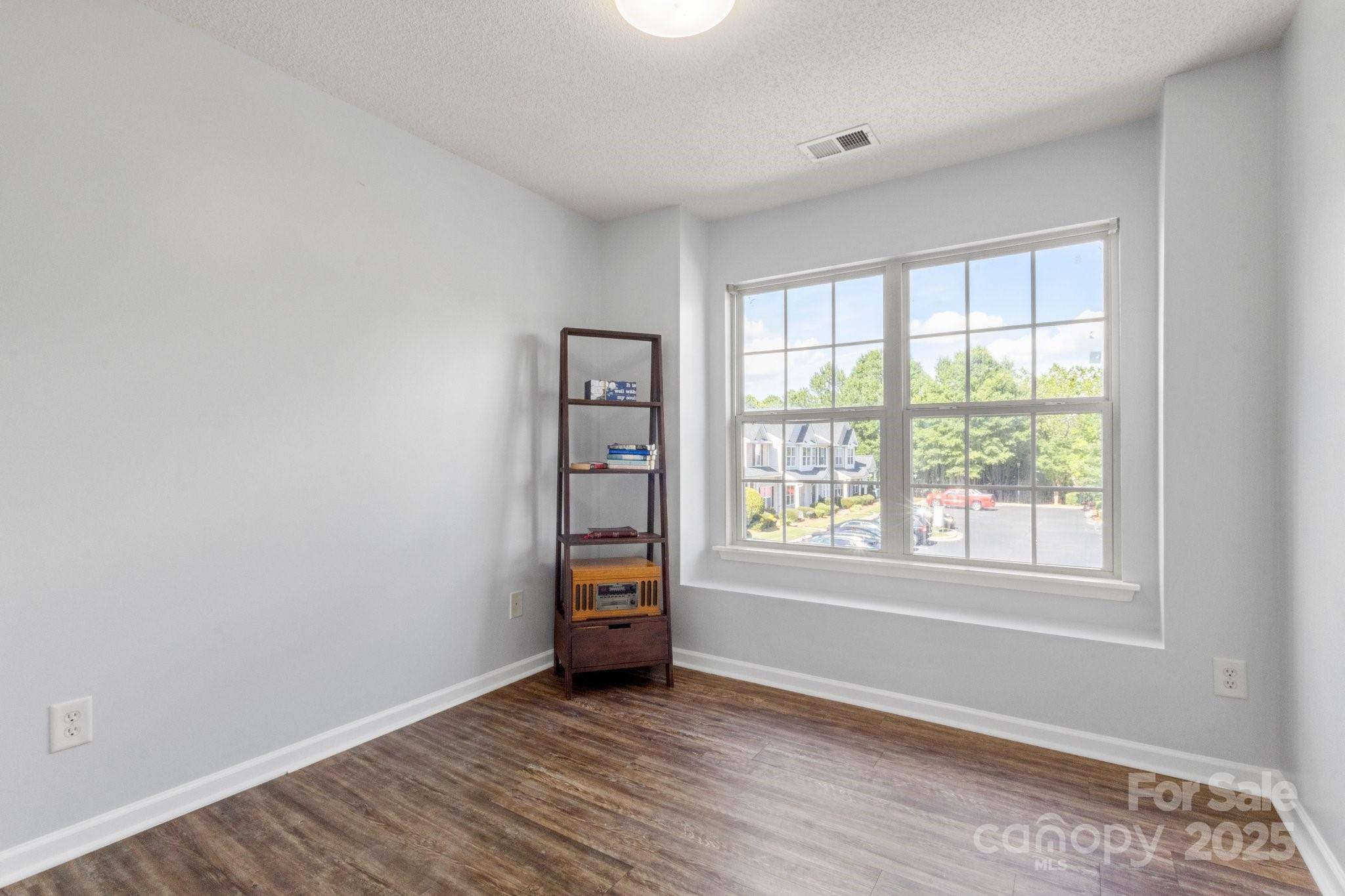 11023 Kinston Ridge Place Charlotte, NC 28273 - Photo 22 of 25 a view of room with window and wooden floor