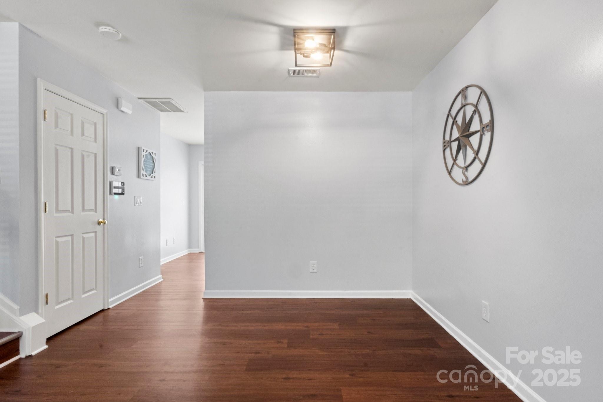 11023 Kinston Ridge Place Charlotte, NC 28273 - Photo 5 of 25 a view of a room with wooden floor