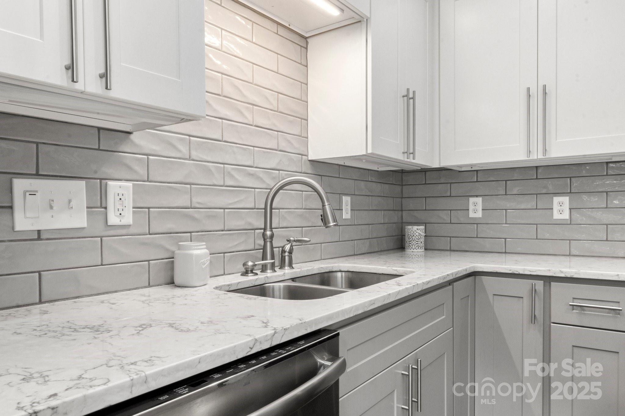 11023 Kinston Ridge Place Charlotte, NC 28273 - Photo 9 of 25 a kitchen with a sink and cabinets
