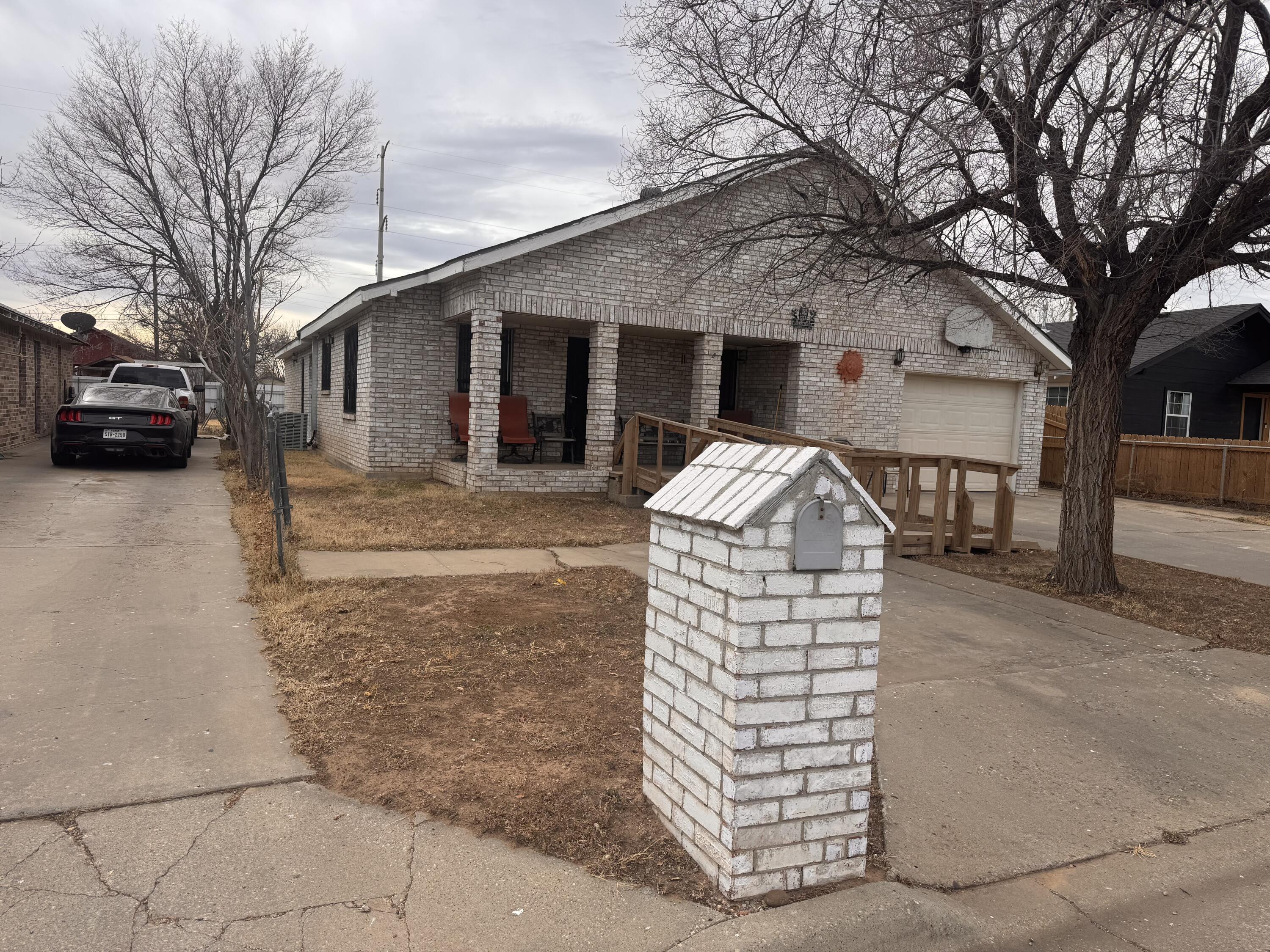 1306 Southeast 11th Avenue Amarillo, TX 79102 - Photo 2 of 6 a front view of a house with parking space