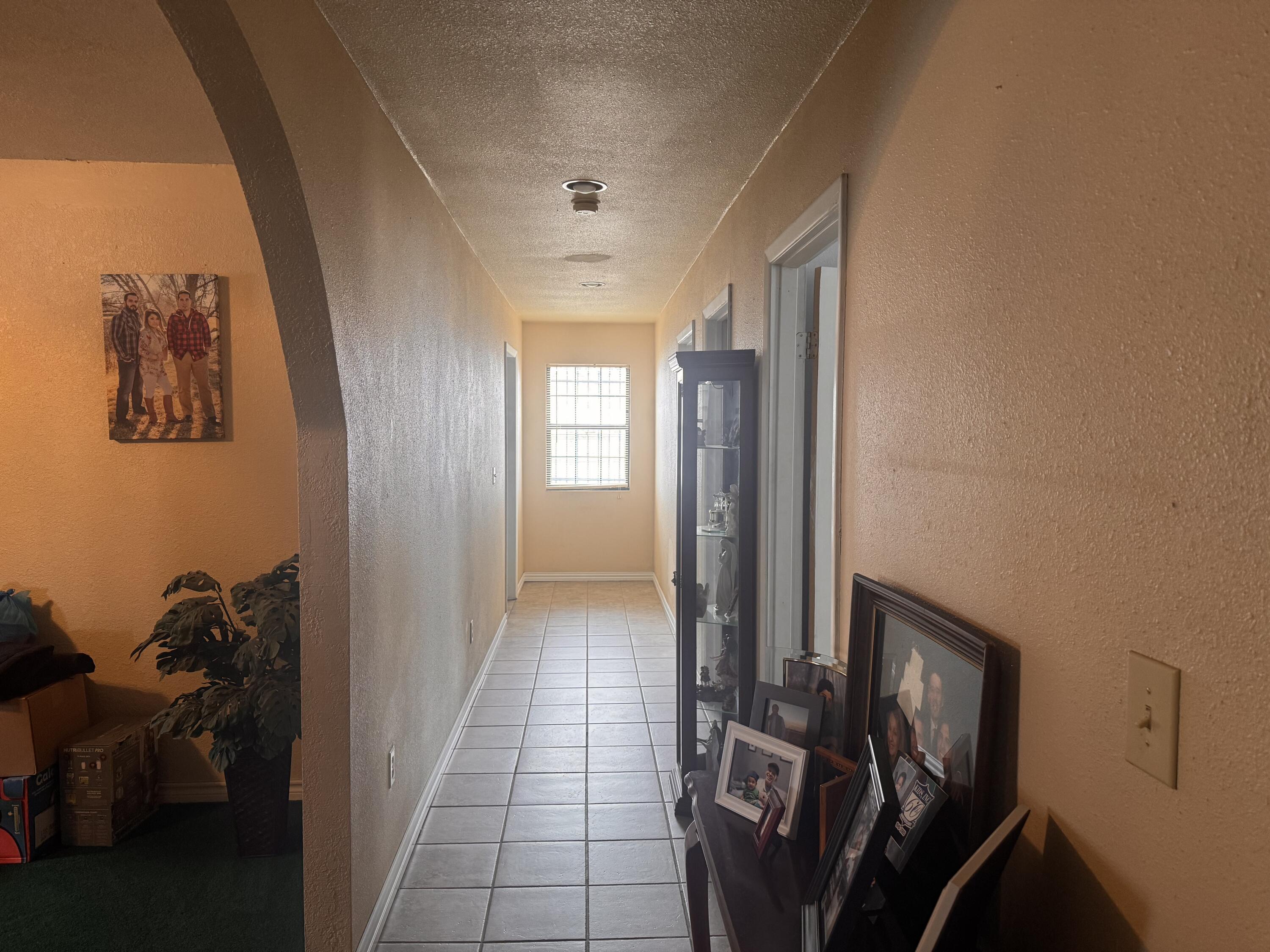1306 Southeast 11th Avenue Amarillo, TX 79102 - Photo 6 of 6 a view of a hallway and a livingroom with furniture