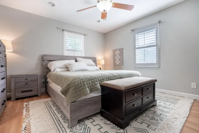 a bedroom with a bed and a window