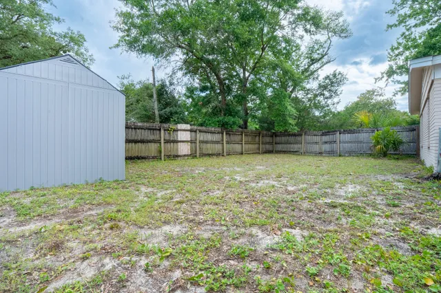 a view of a backyard with a small cabin