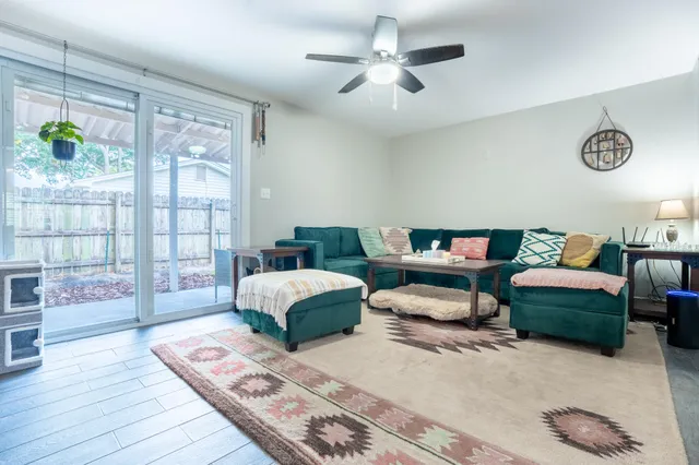 a living room with furniture and a table