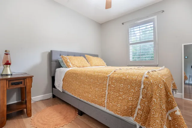 a bedroom with a bed and a window