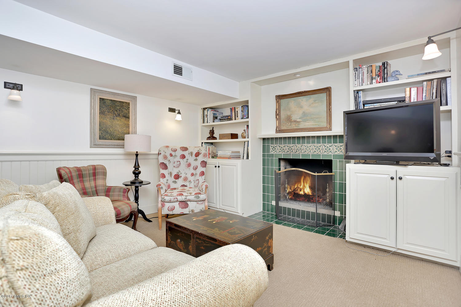 14 Weston Hill Road Riverside, CT 06878 - Photo 12 of 18 a living room with furniture and a flat screen tv