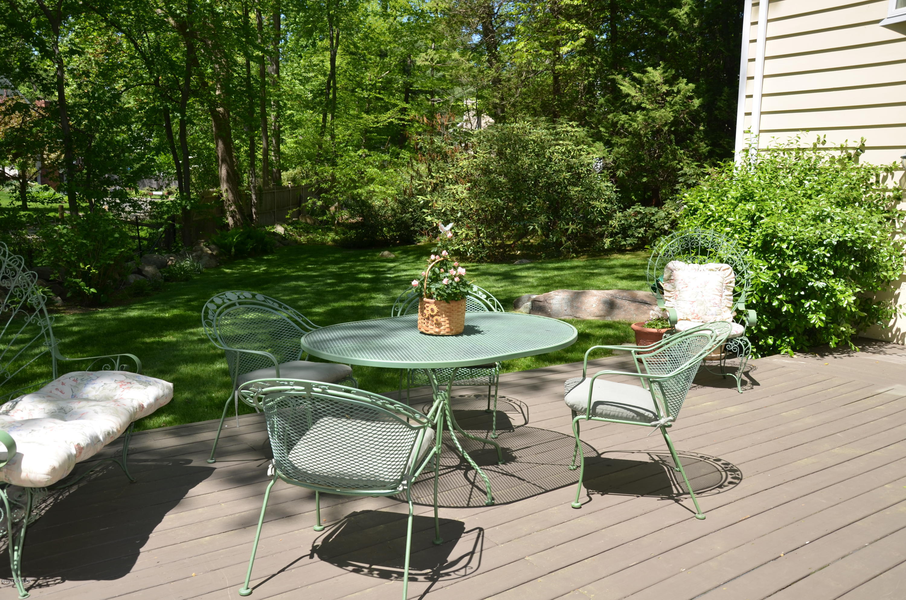 14 Weston Hill Road Riverside, CT 06878 - Photo 16 of 18 a table and chairs in patio with wooden floor