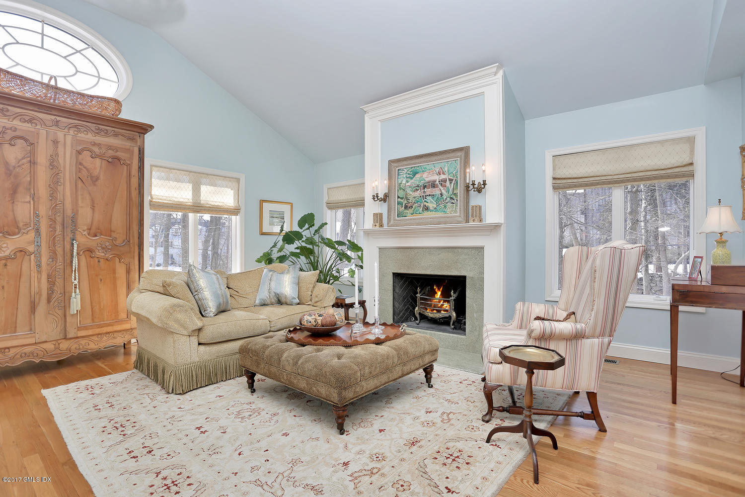 14 Weston Hill Road Riverside, CT 06878 - Photo 2 of 18 a living room with furniture and a fireplace