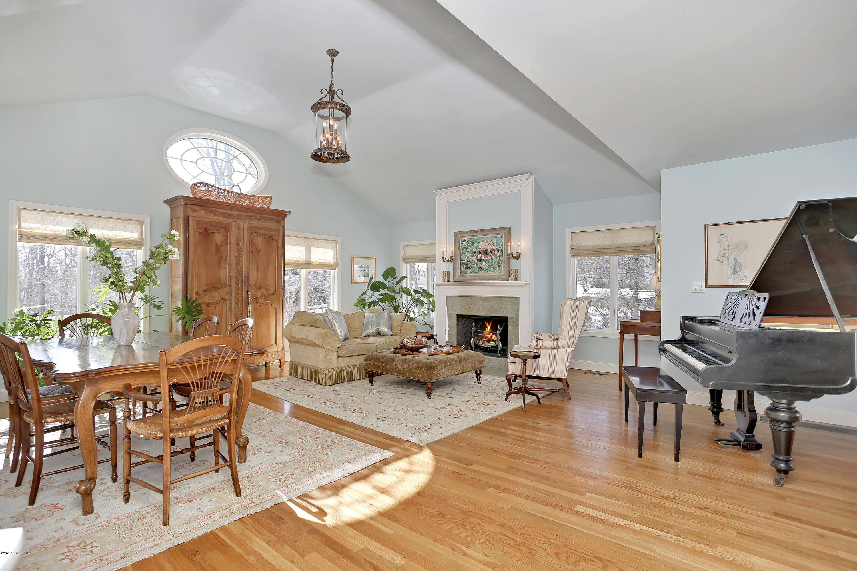14 Weston Hill Road Riverside, CT 06878 - Photo 3 of 18 a living room with furniture a fireplace and a table