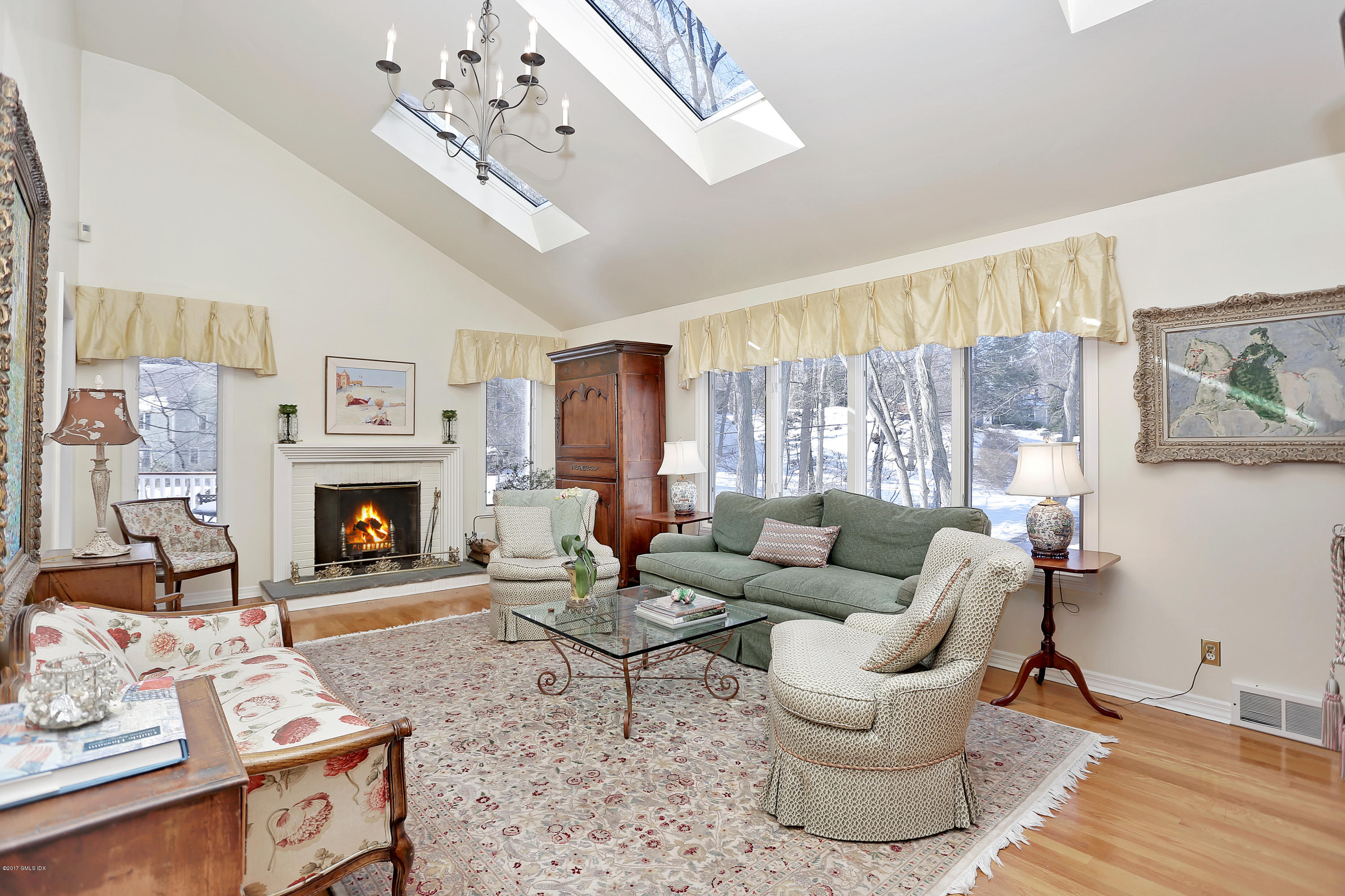14 Weston Hill Road Riverside, CT 06878 - Photo 5 of 18 a living room with furniture and a fireplace