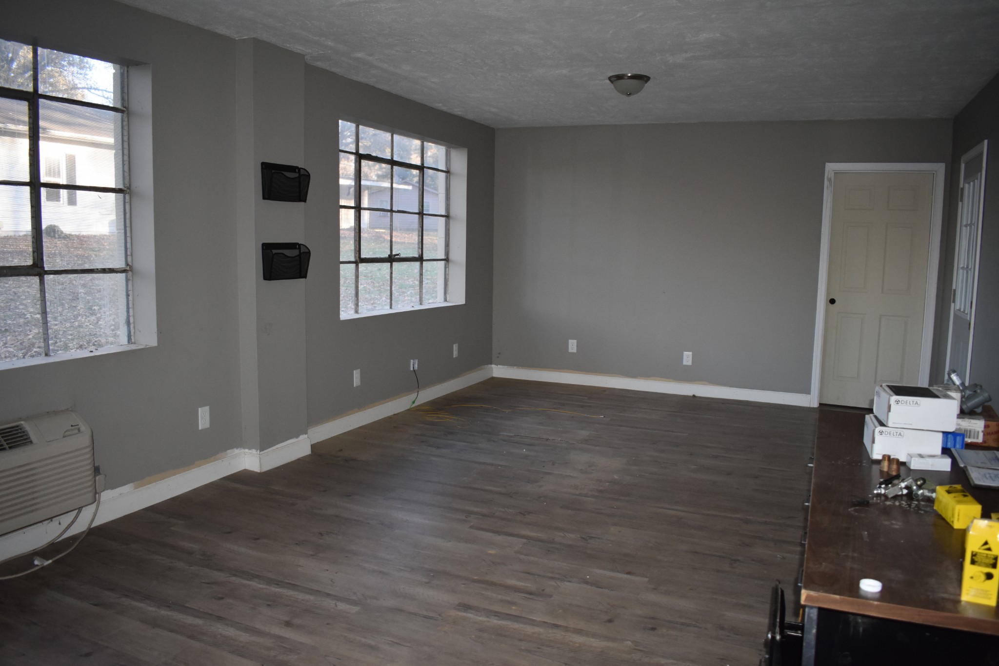 600 Lower Brownsville Road Jackson, TN 38301 - Photo 4 of 4 an empty room with wooden floor and windows