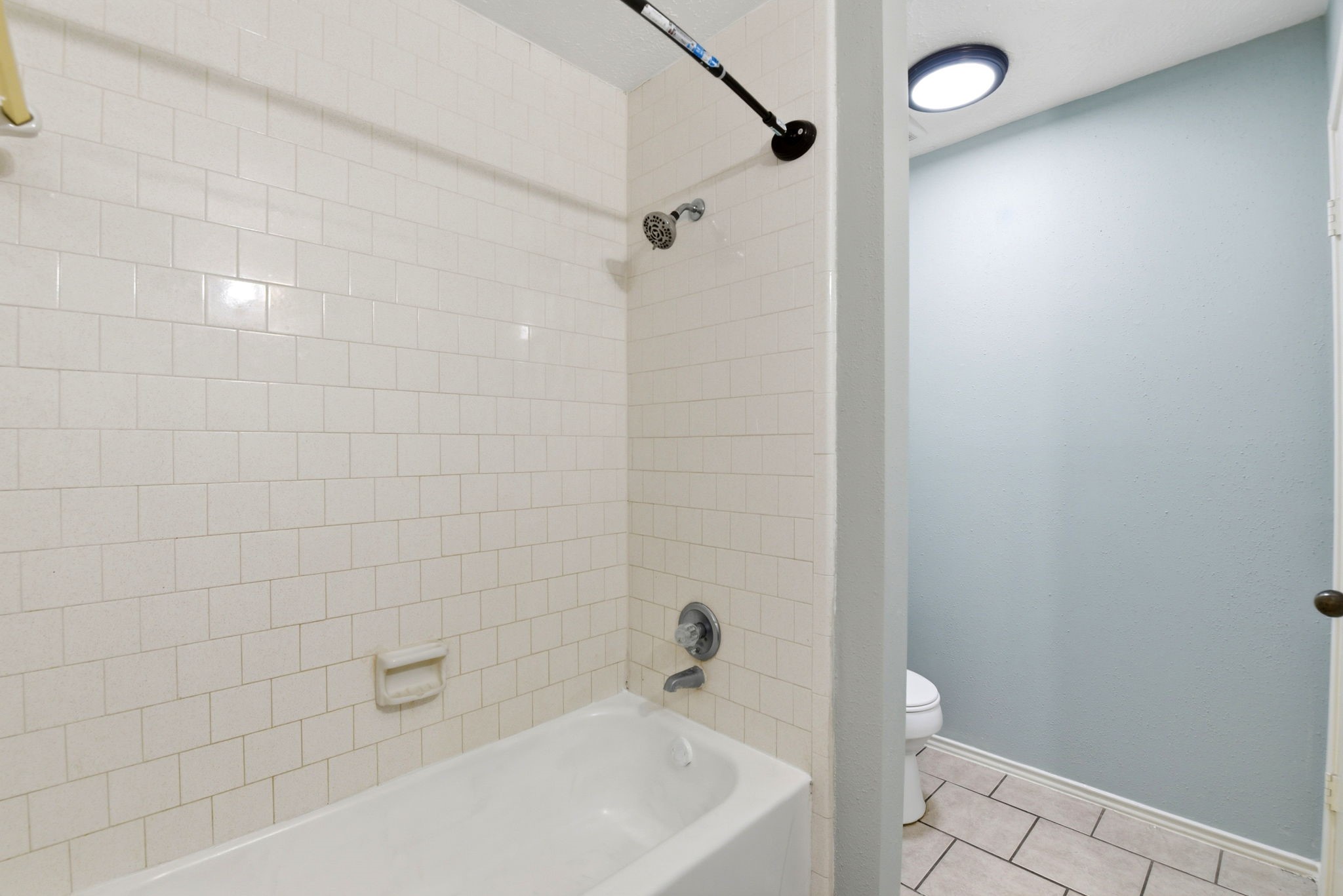 21330 Golden Dove Drive Spring, TX 77388 - Photo 23 of 29 The secondary bath is completed by a clean, easy-to-maintain tub/shower combination.
