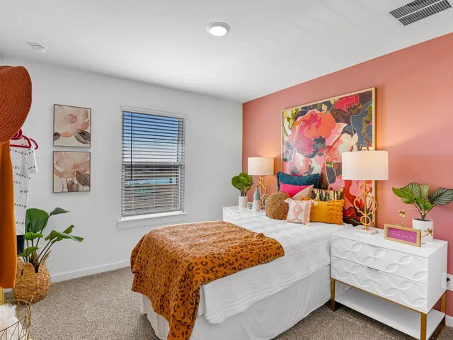 a bedroom with a bed and a couch