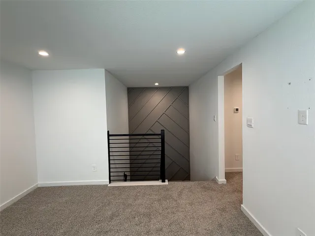 a kitchen with a stove and a wooden floor